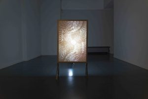 Conjunction (the kiss), painting medium on two overlaying papers, welded and sanded steel stand, 84 x 60cm, 2020