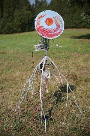 Heliotrope, welded, sanded and painted steel, aluminum, electronics, mirror, lasered acrylic, lead weights, bicycle chain, cable ties, approx 170x150x100cm, 2024