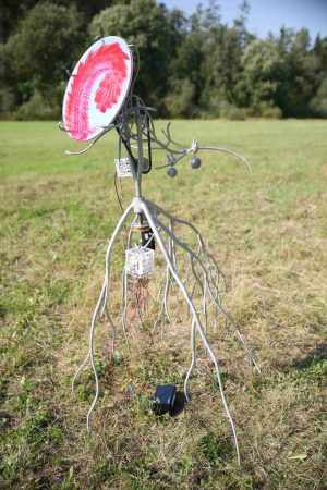 Heliotrope, welded, sanded and painted steel, aluminum, electronics, mirror, lasered acrylic, lead weights, bicycle chain, cable ties, approx 170x150x100cm, 2024 Glass painting Dragon, 2024.