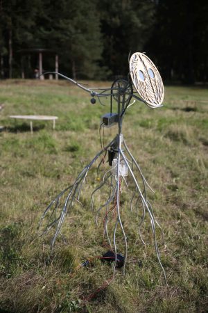 Heliotrope, welded, sanded and painted steel, aluminum, electronics, mirror, lasered acrylic, lead weights, bicycle chain, cable ties, approx 170x150x100cm, 2024 Lasered plywood filter Parity, 2024
