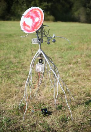 Heliotrope, welded, sanded and painted steel, aluminum, electronics, mirror, lasered acrylic, lead weights, bicycle chain, cable ties, approx 170x150x100cm, 2024 Glass painting Embrace, 2024